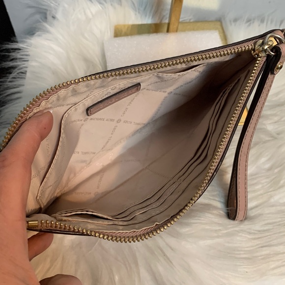 Authentic soft pink patent leather large wristlet clutch by Michael Kors
